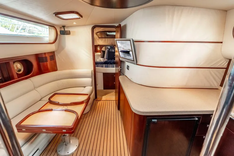 Zissou Yacht Photos Pics Luxurious interior of 2006 Chris-Craft Roamer 40 yacht with elegant seating and wood finishes.