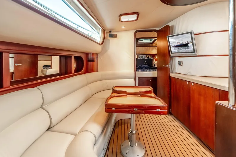 Zissou Yacht Photos Pics Luxurious interior of 2006 Chris-Craft Roamer 40 yacht with elegant seating and wooden finishes.