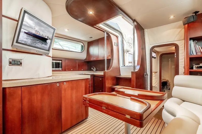 Zissou Yacht Photos Pics Luxurious interior of 2006 Chris-Craft Roamer 40 yacht with wood finishes and modern amenities.