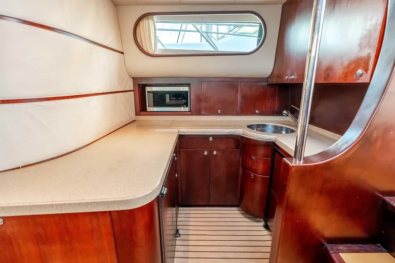 Zissou Yacht Photos Pics Luxurious 2006 Chris-Craft Roamer 40 yacht interior with elegant wood cabinetry and modern amenities.