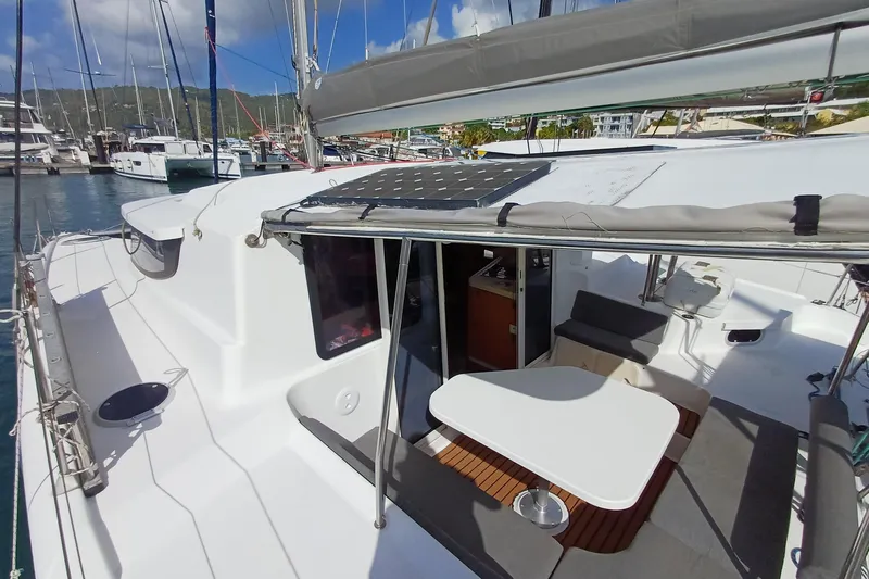  Yacht Photos Pics 2007 Fountaine Pajot Mahe 36 catamaran docked, featuring spacious deck and seating area.