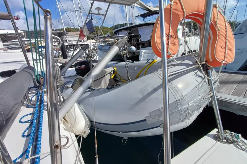  Yacht Photos Pics 2007 Fountaine Pajot Mahe 36 catamaran with dinghy and lifebuoy in marina.