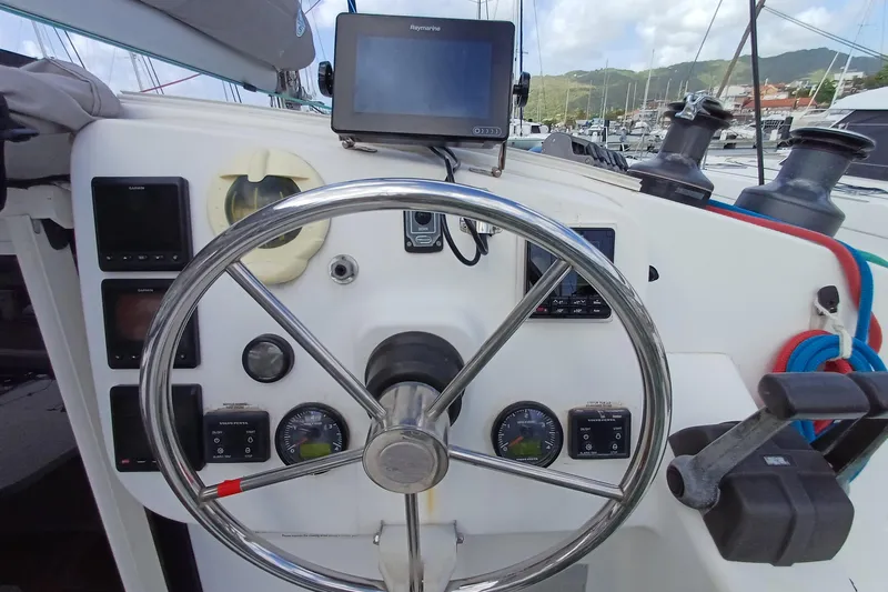  Yacht Photos Pics Steering wheel and controls of 2007 Fountaine Pajot Mahe 36 catamaran, featuring navigation equipment.