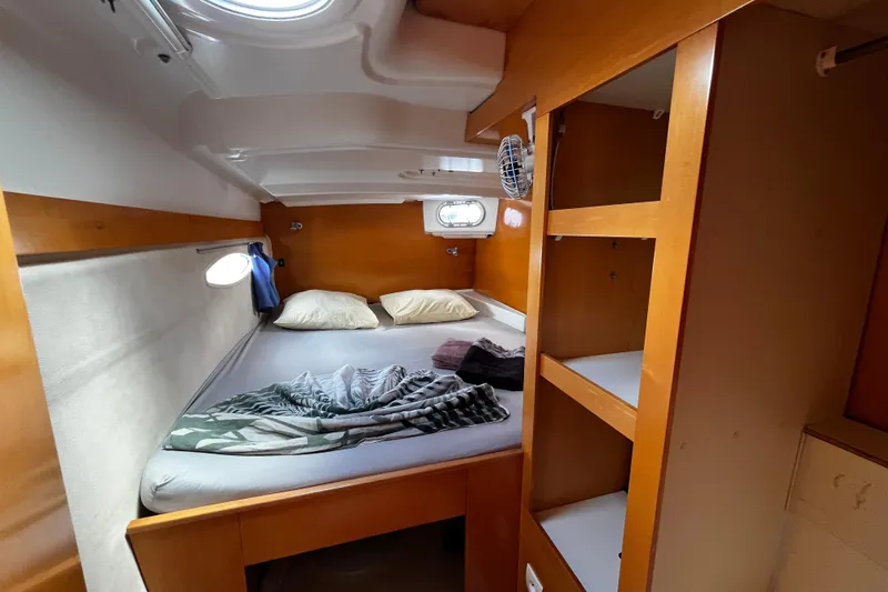  Yacht Photos Pics Cozy cabin interior of 2007 Fountaine Pajot Mahe 36 catamaran with bed and storage.