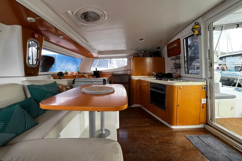  Yacht Photos Pics Interior of 2007 Fountaine Pajot Mahe 36 catamaran with modern kitchen and dining area.