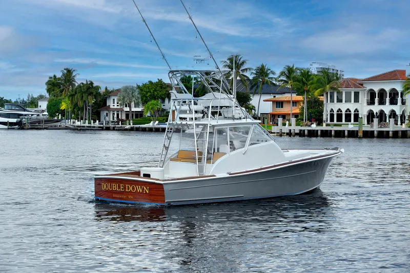"double Down" Yacht Photos Pics 2014 Release Walkaround boat "Double Down" on water near luxury waterfront homes.