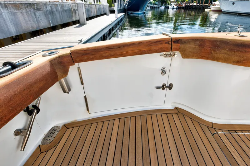 "double Down" Yacht Photos Pics 2014 Release Walkaround boat deck with wooden finish and dock view.