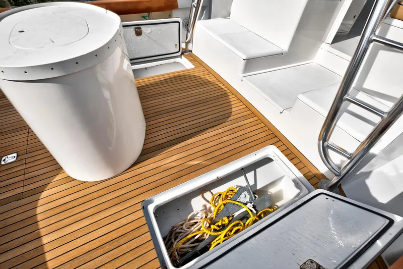 "double Down" Yacht Photos Pics 2014 Release Walkaround boat deck with storage compartments and ladder.