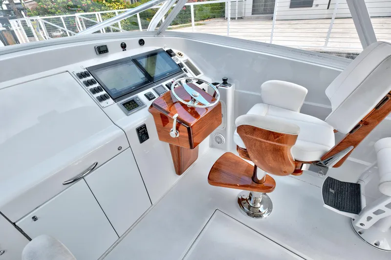 "double Down" Yacht Photos Pics Luxurious 2014 Release Walkaround yacht helm with wooden accents and modern navigation controls.