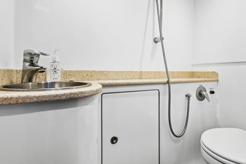 "double Down" Yacht Photos Pics Compact boat bathroom with sink, faucet, and showerhead in a 2014 Release Walkaround model.