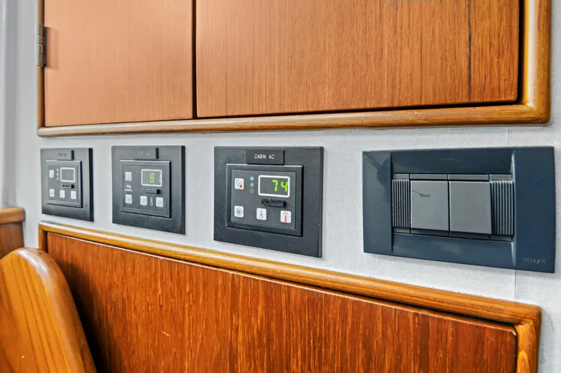 "double Down" Yacht Photos Pics Control panel on a 2014 Release Walkaround boat with wooden cabinetry.