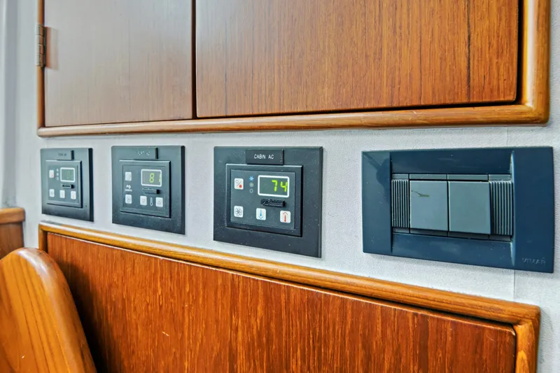 "double Down" Yacht Photos Pics Control panels on a 2014 Release Walkaround boat, featuring AC and switch controls.