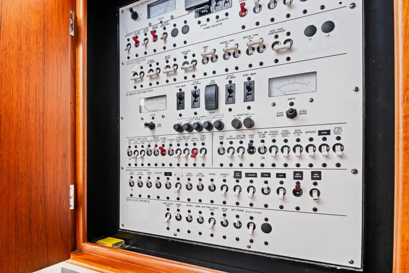 "double Down" Yacht Photos Pics Electrical control panel inside a wooden cabinet on a 2014 Release Walkaround boat.