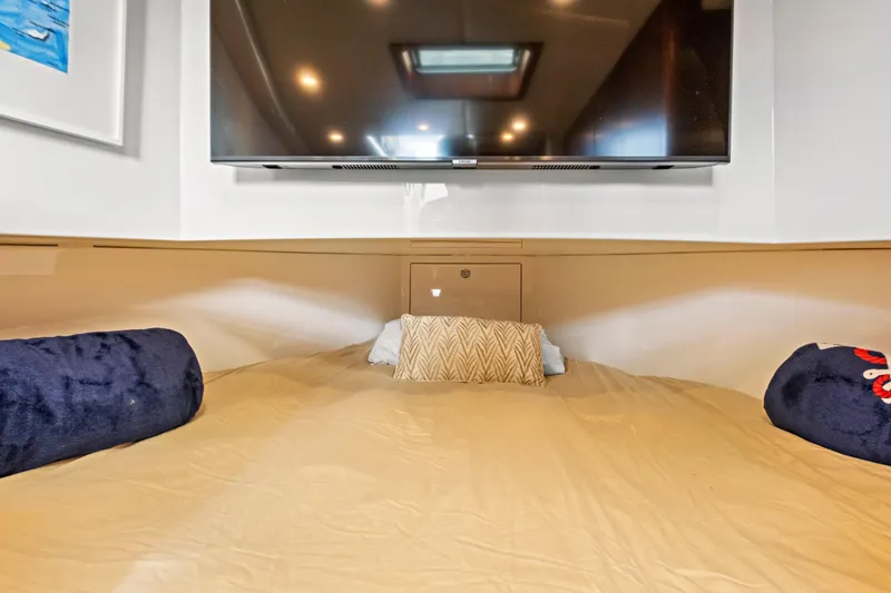 "double Down" Yacht Photos Pics Cozy cabin interior with TV, pillows, and soft lighting on a 2014 Release Walkaround.