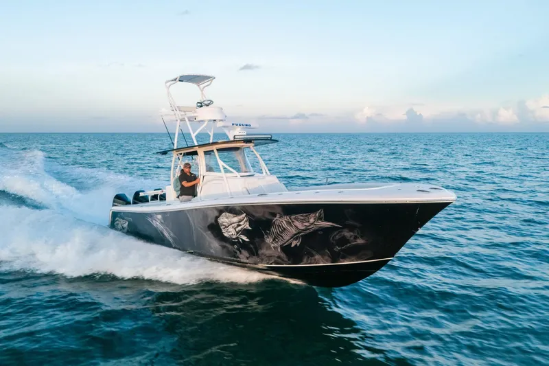  Yacht Photos Pics 2023 Front Runner 36 Center Console boat cruising on open ocean waters.