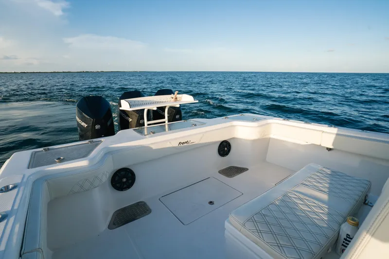  Yacht Photos Pics 2023 Front Runner 36 Center Console boat on open water, featuring spacious seating and dual engines.