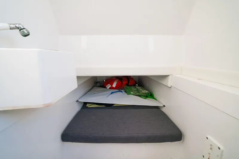  Yacht Photos Pics 2023 Front Runner 36 Center Console cabin interior with storage and seating area.