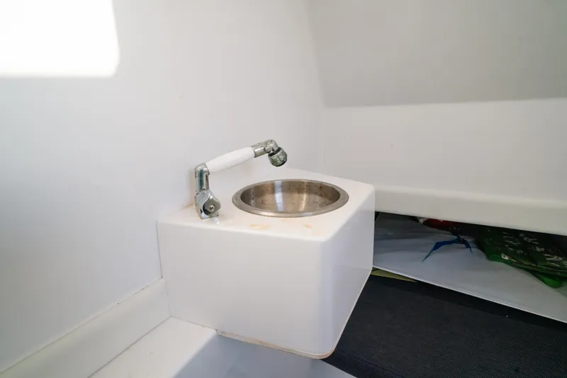  Yacht Photos Pics Compact sink in 2023 Front Runner 36 Center Console boat interior.