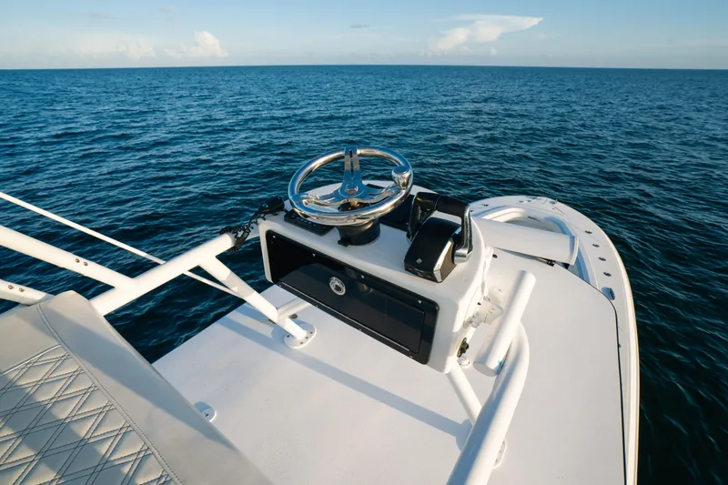  Yacht Photos Pics 2023 Front Runner 36 Center Console boat on open sea, featuring sleek helm design.