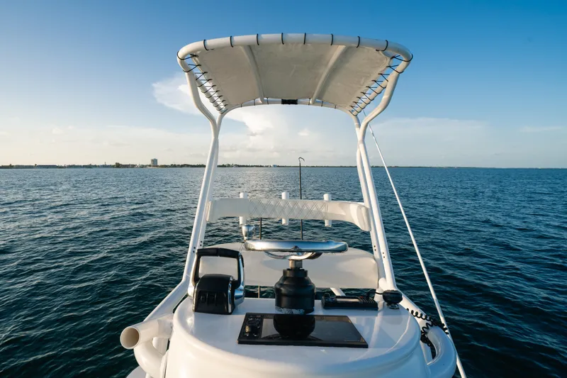  Yacht Photos Pics 2023 Front Runner 36 Center Console boat on open water, clear sky.
