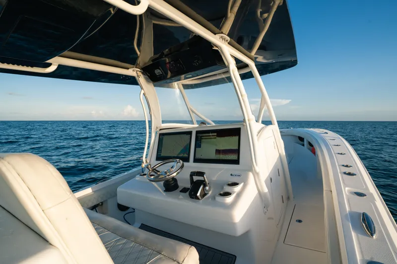  Yacht Photos Pics 2023 Front Runner 36 Center Console boat on open sea, featuring modern navigation equipment.