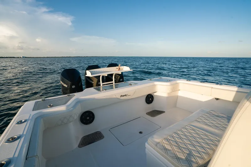  Yacht Photos Pics 2023 Front Runner 36 Center Console boat on open water, showcasing spacious seating and dual engines.
