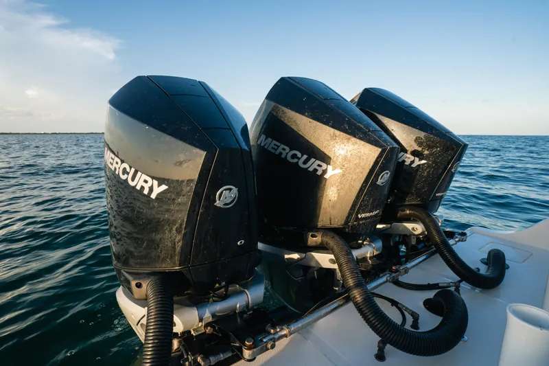  Yacht Photos Pics Triple Mercury outboard engines on a 2023 Front Runner 36 Center Console boat in open water.