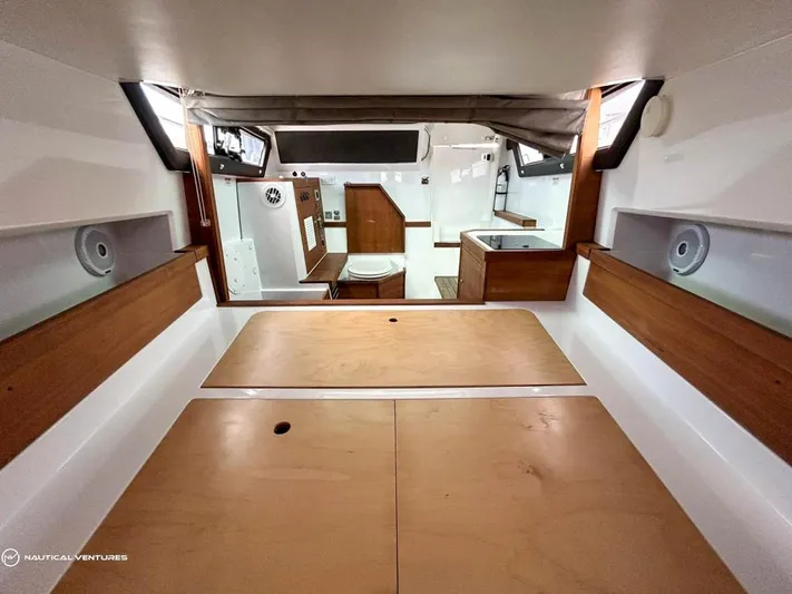  Yacht Photos Pics Interior cabin of 2018 Axopar 37 Sun Top boat with wooden finishes.