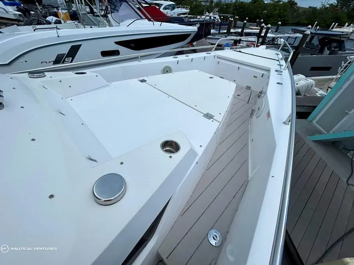  Yacht Photos Pics 2018 Axopar 37 Sun Top boat docked at marina, showcasing spacious deck.
