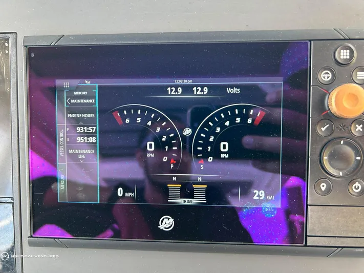  Yacht Photos Pics Dashboard display of a 2018 Axopar 37 Sun Top showing engine hours and fuel levels.