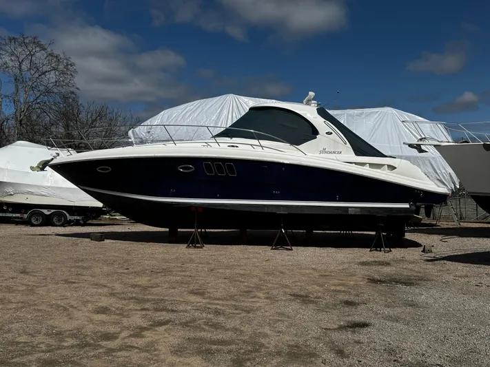  Yacht Photos Pics 2006 Sea Ray 380 Sundancer yacht on stands, outdoor storage, clear sky.