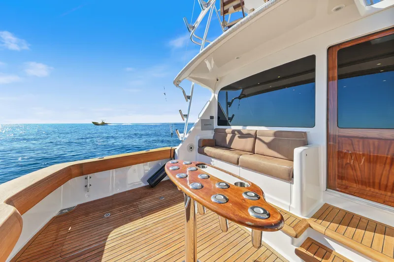 Trouble Maker Yacht Photos Pics Luxurious 2013 Viking 46 Convertible yacht deck with ocean view and seating area.