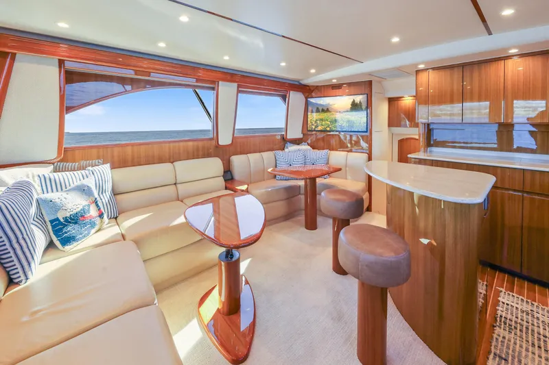 Trouble Maker Yacht Photos Pics Luxurious interior of 2013 Viking 46 Convertible yacht with elegant seating and wooden finishes.