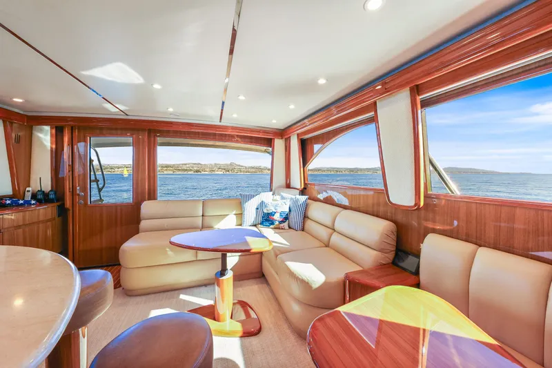 Trouble Maker Yacht Photos Pics Luxurious interior of 2013 Viking 46 Convertible yacht with leather seating and ocean view.