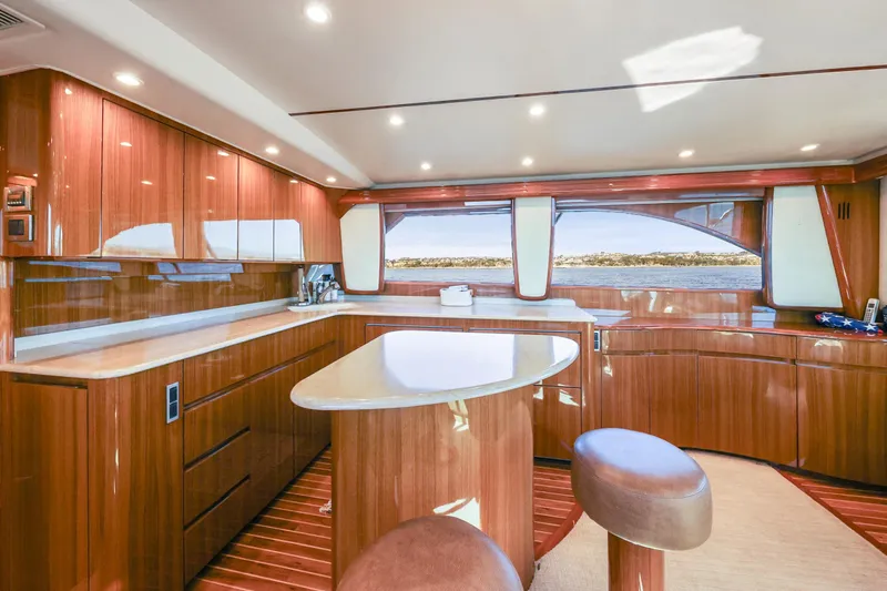 Trouble Maker Yacht Photos Pics Luxurious interior of 2013 Viking 46 Convertible yacht with polished wood finishes.
