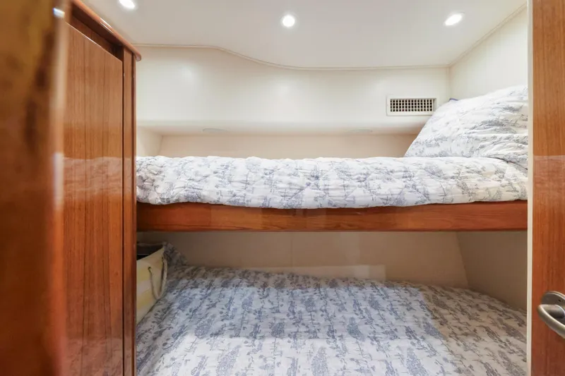 Trouble Maker Yacht Photos Pics Bunk beds in 2013 Viking 46 Convertible yacht cabin with wood accents.