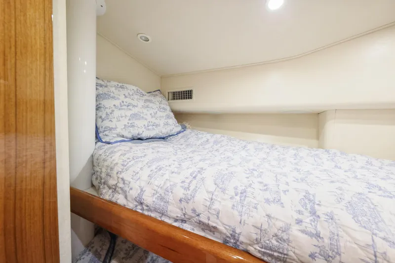 Trouble Maker Yacht Photos Pics Cozy cabin bed in 2013 Viking 46 Convertible yacht with patterned bedding.