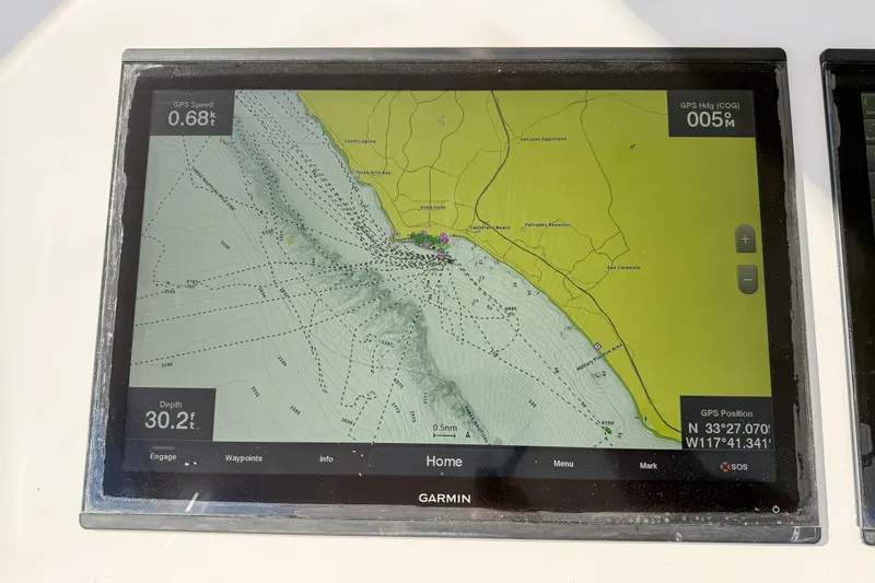 Trouble Maker Yacht Photos Pics Garmin GPS display on 2013 Viking 46 Convertible, showing coastal navigation map and coordinates.