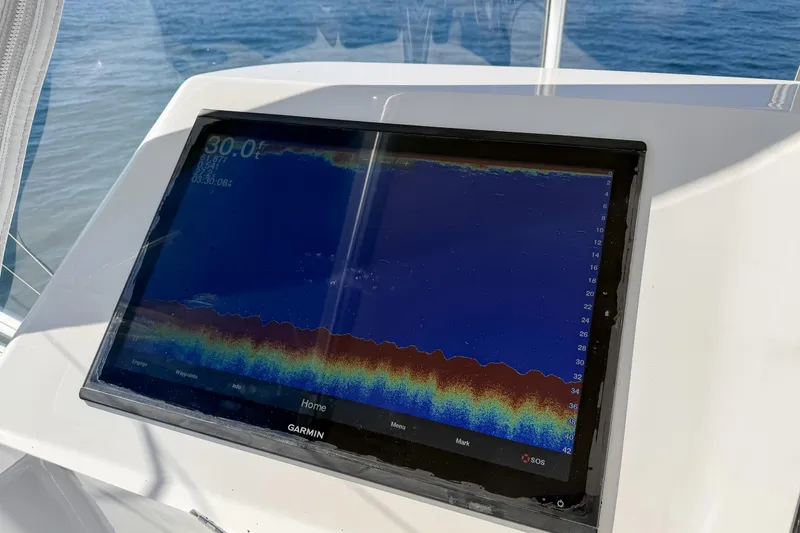 Trouble Maker Yacht Photos Pics Garmin marine display on 2013 Viking 46 Convertible, showing sonar data.
