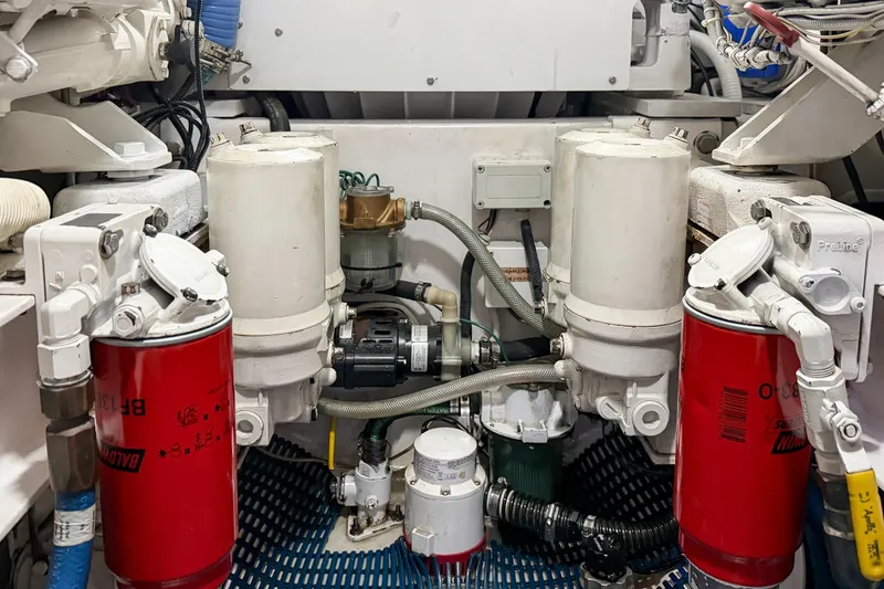 Trouble Maker Yacht Photos Pics Engine room of 2013 Viking 46 Convertible yacht with filters and machinery.