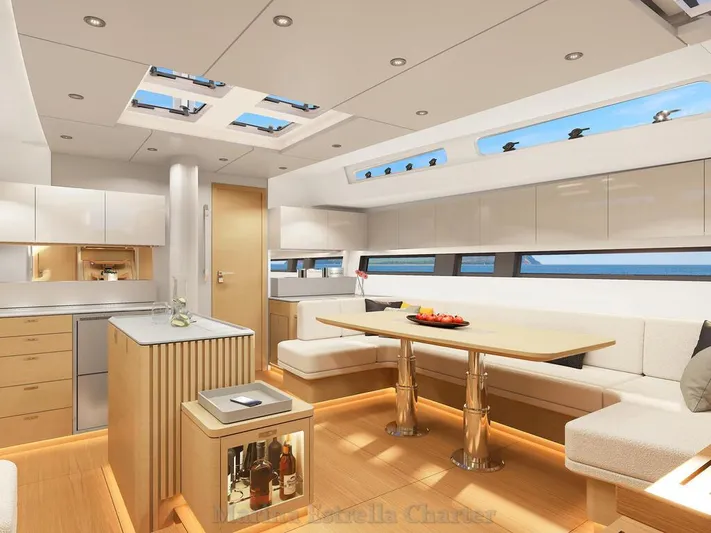  Yacht Photos Pics Luxurious interior of 2025 Hanse 590 yacht with modern kitchen and dining area.