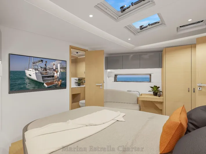  Yacht Photos Pics Luxurious interior of 2025 Hanse 590 yacht cabin with modern furnishings and skylights.