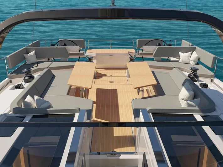  Yacht Photos Pics Luxurious 2025 Hanse 590 yacht deck with elegant seating and tables, overlooking serene blue waters.