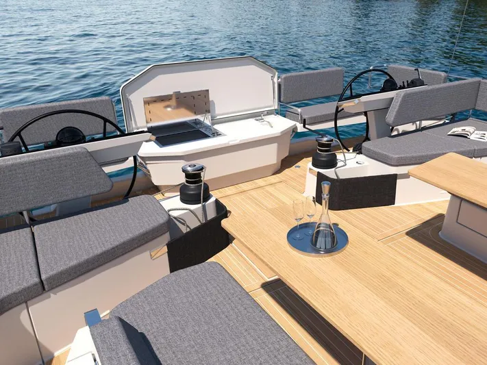  Yacht Photos Pics Luxurious 2025 Hanse 590 yacht deck with seating, steering wheels, and ocean view.