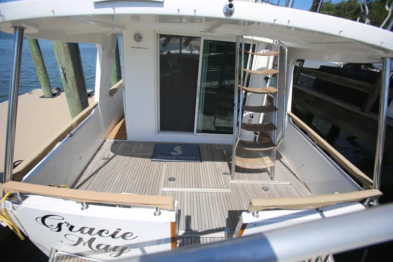 Gracie May Yacht Photos Pics 2007 Beneteau Swift Trawler 42, rear deck view with spiral staircase and sliding doors.