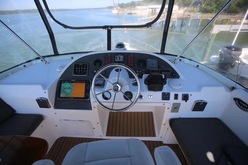 Gracie May Yacht Photos Pics 2007 Beneteau Swift Trawler 42 helm with navigation instruments and steering wheel.