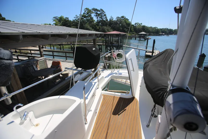 Gracie May Yacht Photos Pics 2007 Beneteau Swift Trawler 42 docked, featuring spacious deck and scenic waterfront view.