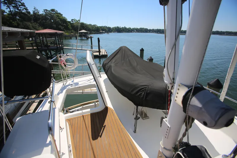 Gracie May Yacht Photos Pics 2007 Beneteau Swift Trawler 42 docked, featuring covered deck and scenic waterfront view.