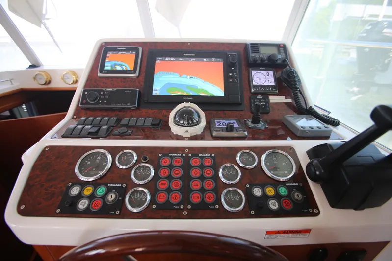 Gracie May Yacht Photos Pics Control panel of a 2007 Beneteau Swift Trawler 42 with navigation instruments.