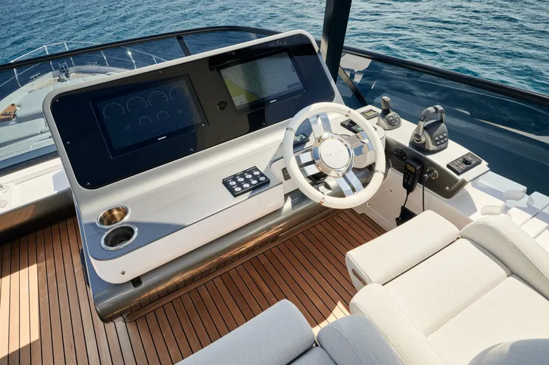  Yacht Photos Pics Luxurious helm of 2022 Azimut 68 Hard Top yacht with advanced controls and stabilizers.